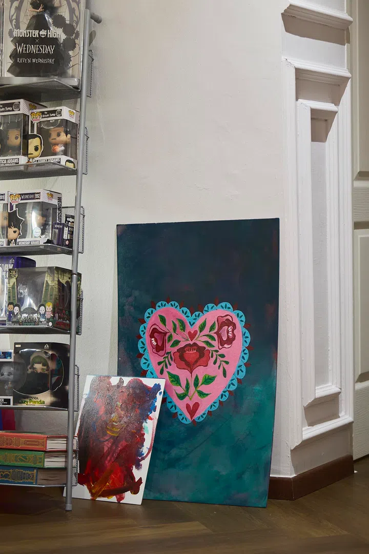 Artworks—some completed, others still in progress—are layered into the space, reflecting an active and evolving creative practice.