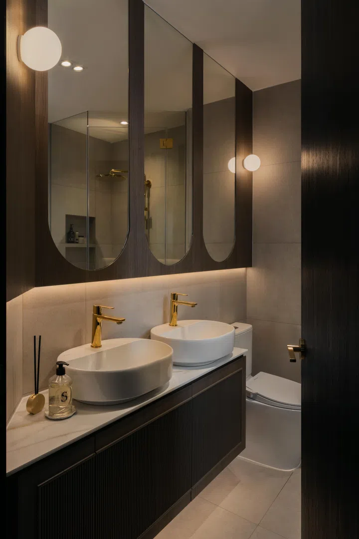 Brass-gold fittings and dark wood tones in the master bathroom.