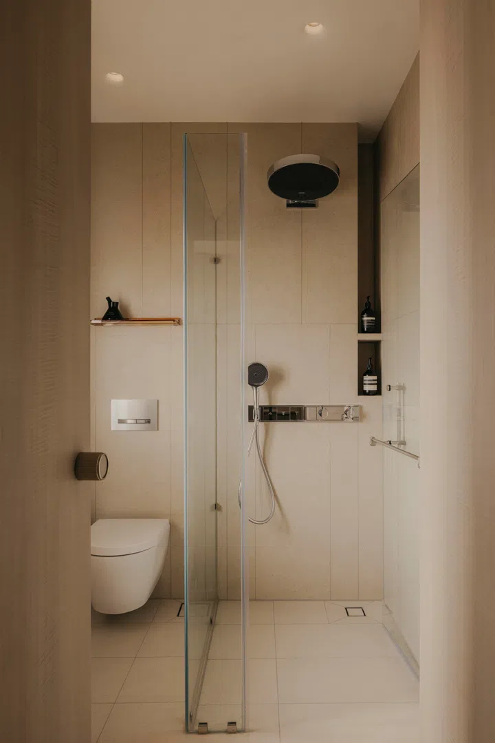 The primary bathroom sticks to the same colour palette as the rest of the home.
