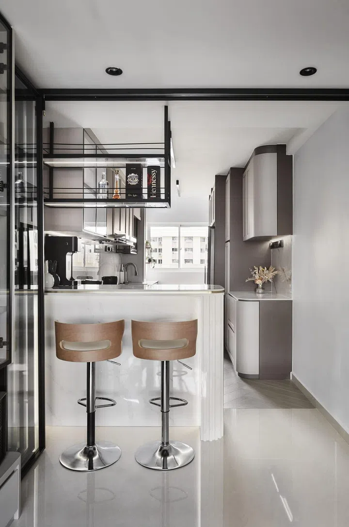 Curved kitchen cabinets in this 1,303 sq ft Tampines 5-room HDB.