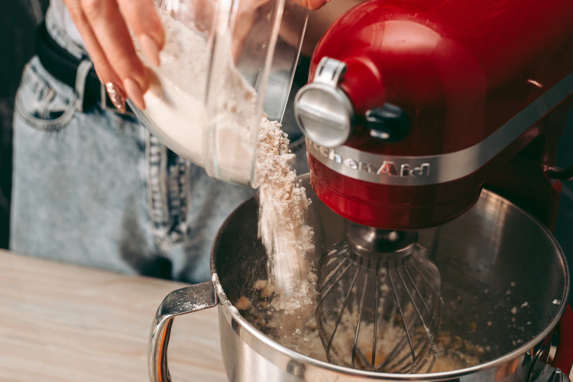 The baking process of baking pies and cookies in the kitchen with a KitchenAid stand mixer and attachment accessories.