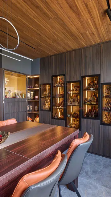 Glass wall display cabinet houses the homeowner's crystal collection in a HDB Executive Maisonette in Pasir Ris.