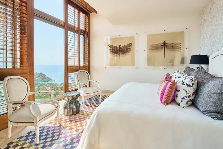 Large louvered panels frame the beautiful vista of the surrounding scenery.