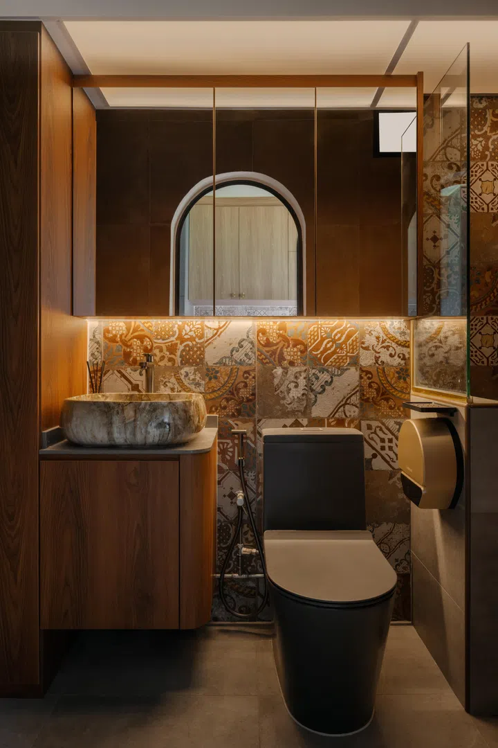 Inspired by a Pinterest image his mother shared, the bathroom combines earthy tones, patterned tiles and a stone basin into a serene sanctuary.