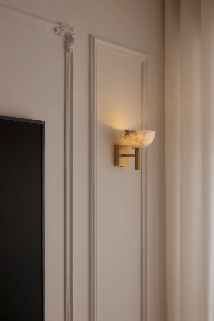 Wall sconce in the living room of a 4-room HDB BTO (1,004 sq ft) in Bishan, designed by RENOSTUD.IO.