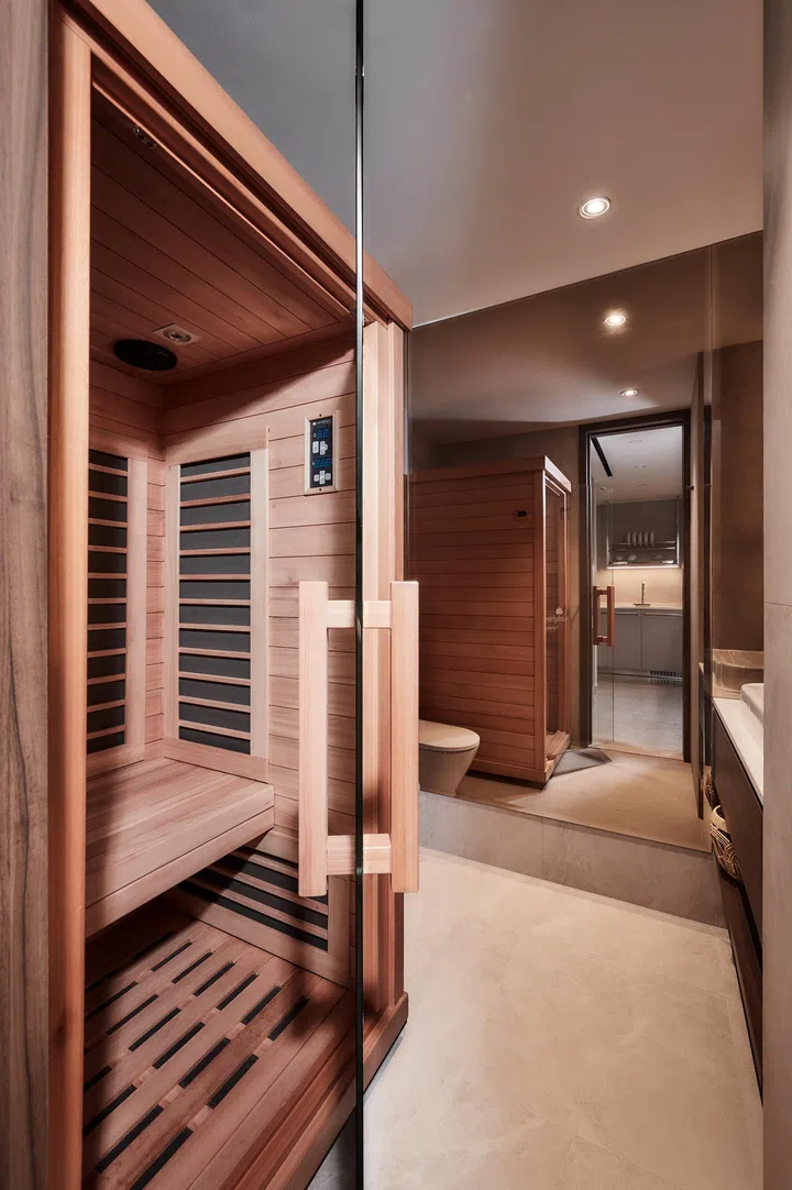 A compact sauna stars in this redesigned powder room, the result of careful spatial reconfiguration by Collective Designs.