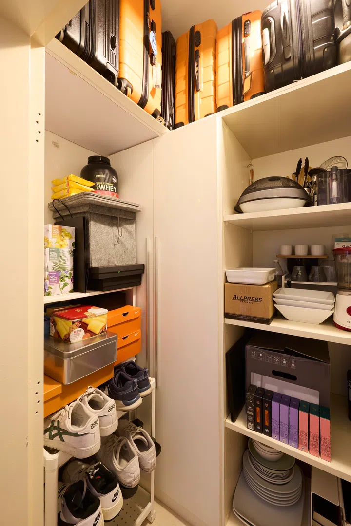 Shelving within the bomb shelter is organised to neatly accommodate shoes, household items and everyday essentials.