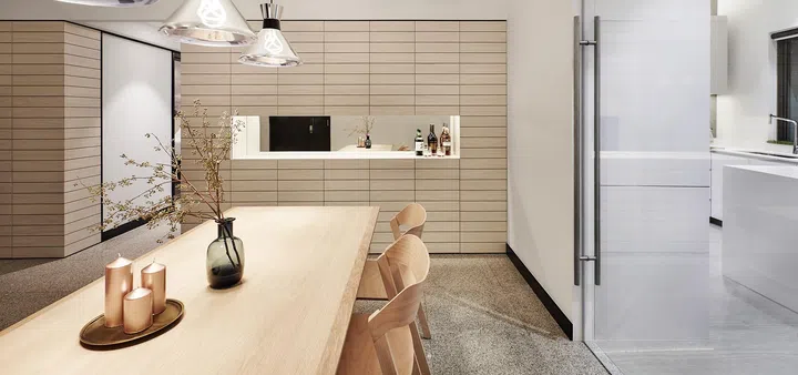 The dining room with view of the kitchen in a 3-bedroom condominium in East Coast.