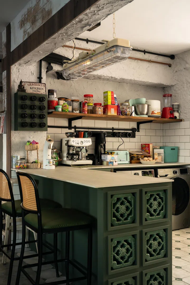 Retro nodes decorate the kitchen. The island is where the family enjoy breakfast.