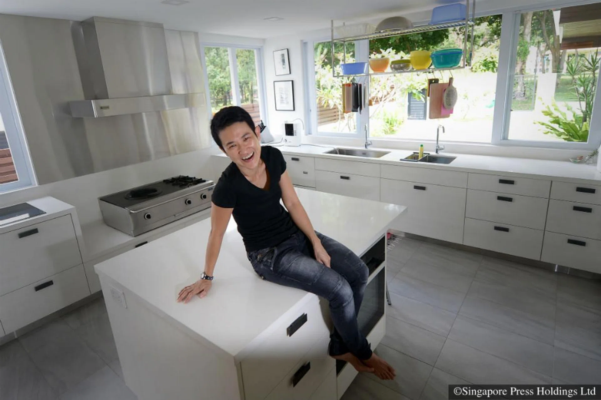 Calsia Lee, founder of Mudian, poses for a photo in her kitchen.