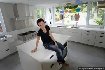Calsia Lee, founder of Mudian, poses for a photo in her kitchen.