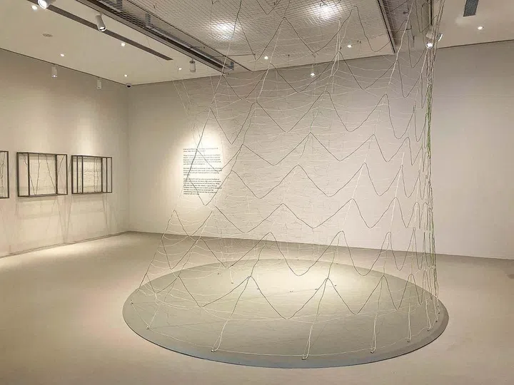 Weaving in an exaggerated scale using a three-dimensional loom at Singapore Art Week 2023.