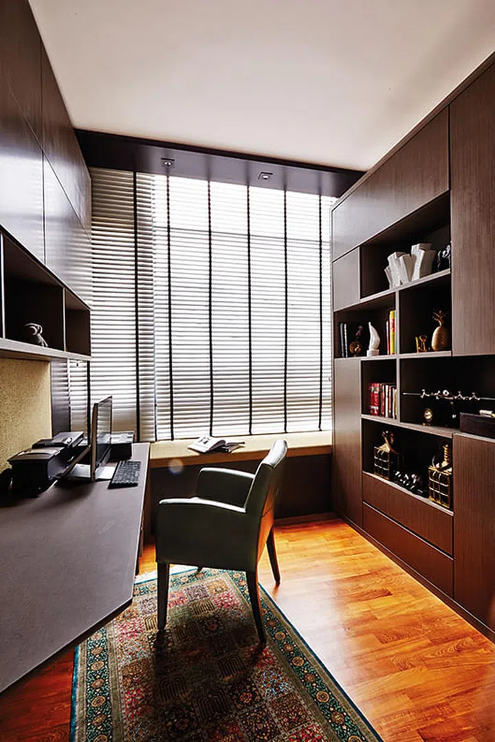 A silk carpet from The Orientalist adds a soft touch to the study's nearly full-height cabinetry.