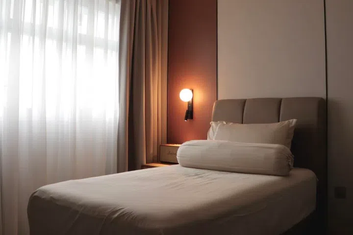 Lighting adds to the polished feel of Sebastian’s flat.