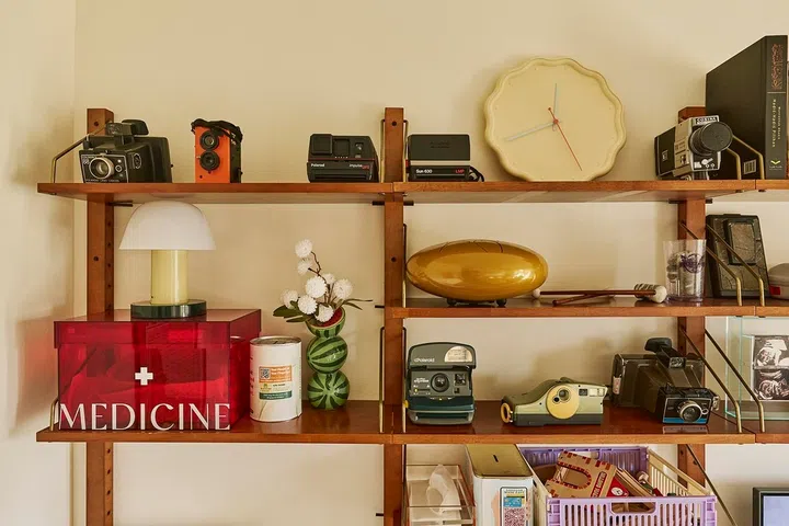 Collected curios, analogue photography gear and personal memorabilia offer a glimpse into the stories that shaped this creative couple’s lives.