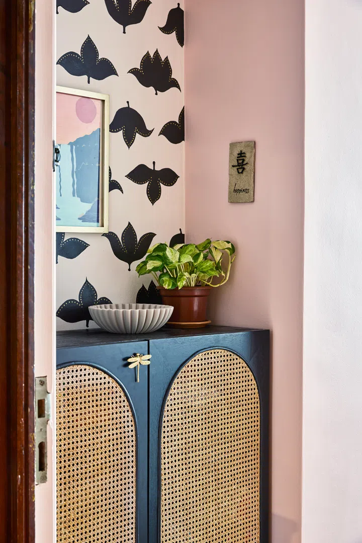 A creamy rose wall colour and rattan shoe cabinet from Taobao welcomes guests at the entrance foyer of this 3-bedroom condo along Balestier Road.
