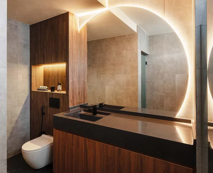 The master
bathroom has

a custom-
designed mirror

that continues
the theme in the
common areas.