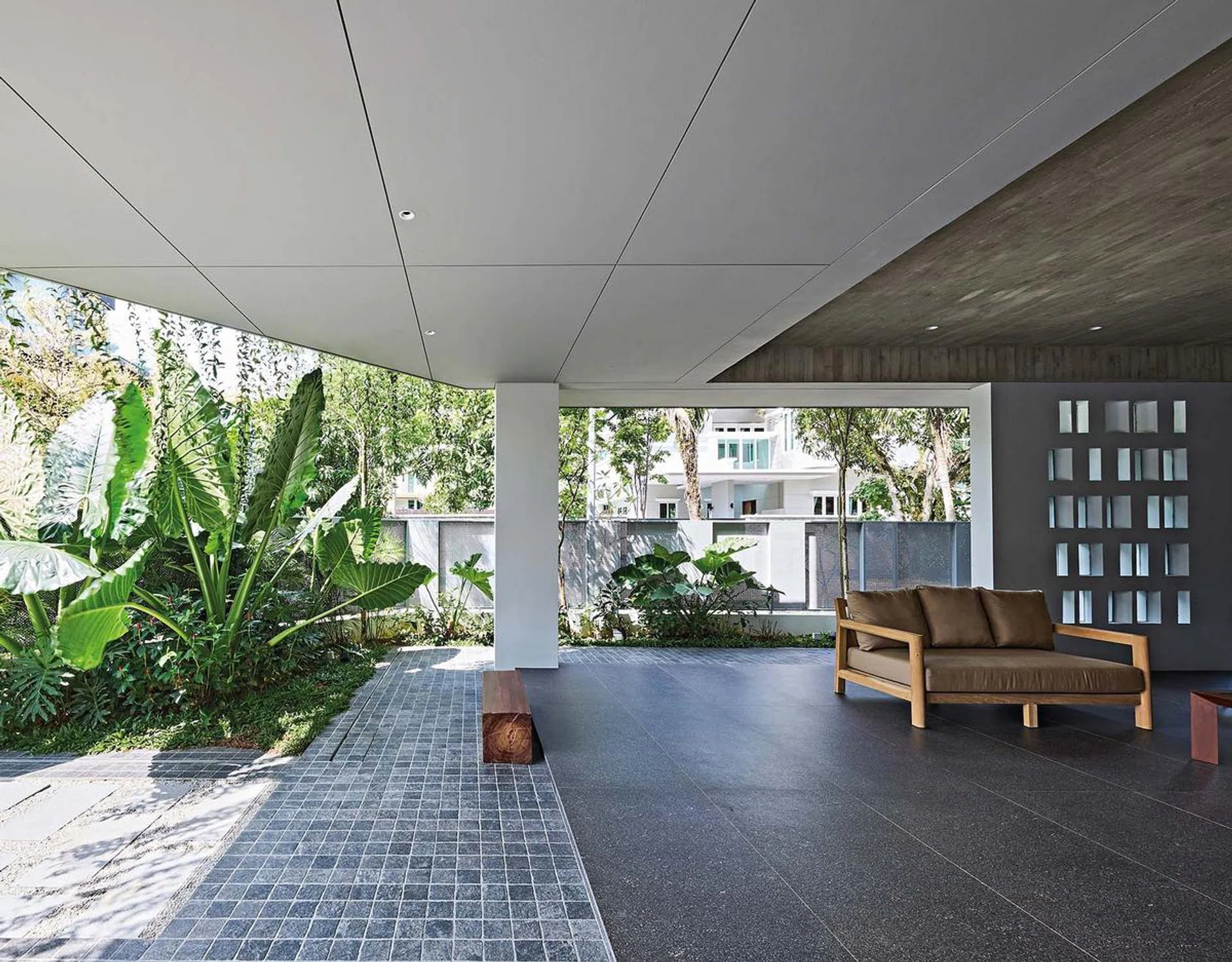 The homeowner and his family enjoy hosting social gatherings with family and friends, so it was important to create larger shared spaces such as this semi-open living area within the Bukit Timah corner terrace house.