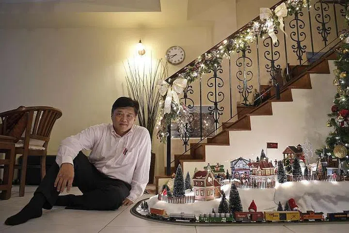 Mr Steve Tai added a miniature train set with tracks to his Christmas village this year.ST PHOTO: CAROLINE CHIA