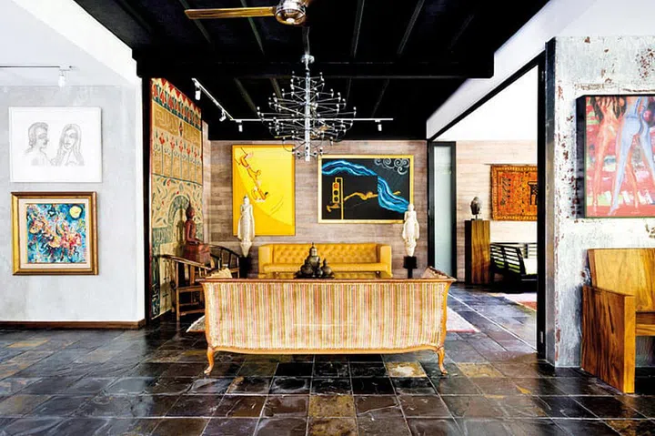The foyer, visible on the right, is panelled in galvanized steel that has been roughly scrubbed and acid-washed to attract rust.