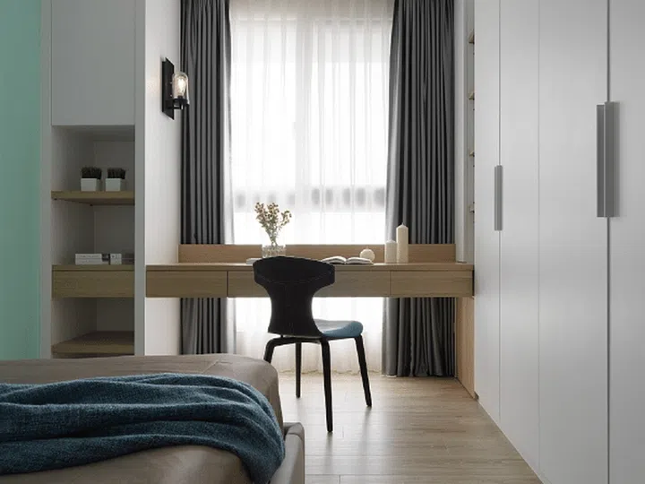 The study cum dressing table was cleverly positioned right in front of the window to offer sufficient natural light. Interior design by Summer Samson.
