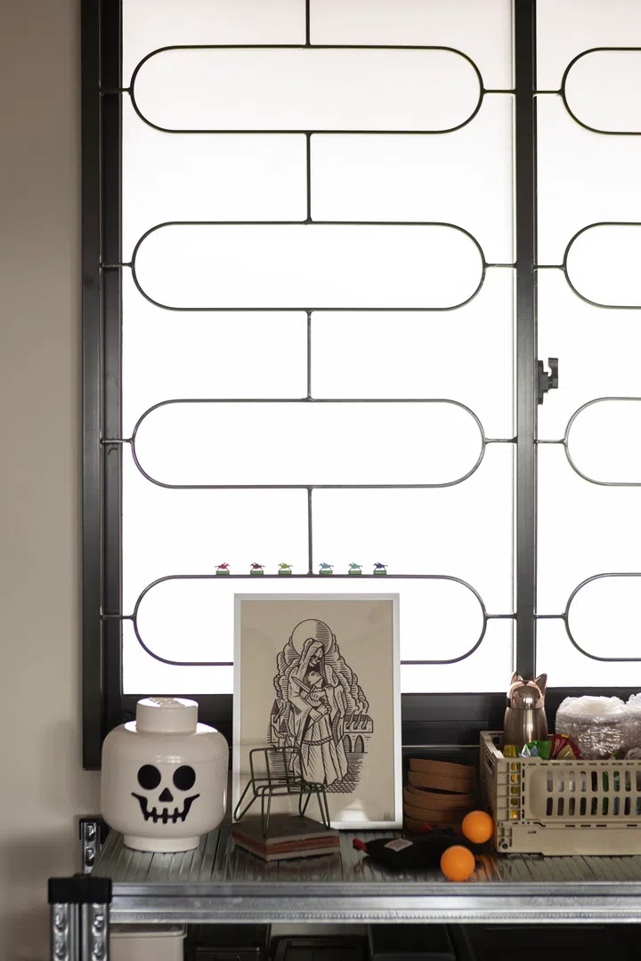 The homeowner and interior designer got this nostalgic, old-school window grille custom-made.