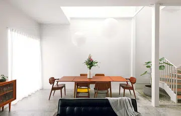 The living and dining rooms have an open plan and an abundance of natural light.