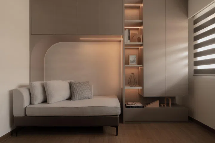In the study, curved forms are used sparingly, framing a built-in daybed while allowing cleaner lines and muted lighting to support focus and rest.