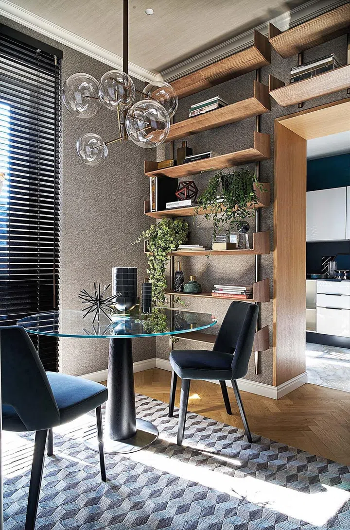 A series of open shelves surrounds the doorway leading into the kitchen, creating a clean yet stylish aesthetic.