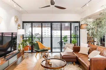 Large windows bring in light and views, but also significant heat—especially in sun-drenched homes without the right layers of protection.