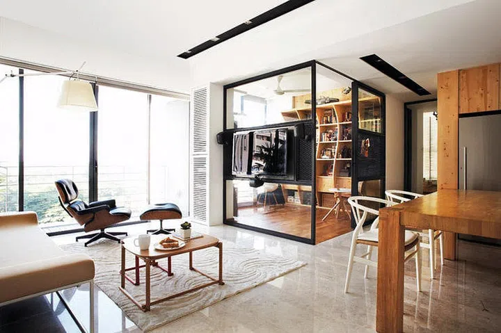 TV mounted on a glass wall.