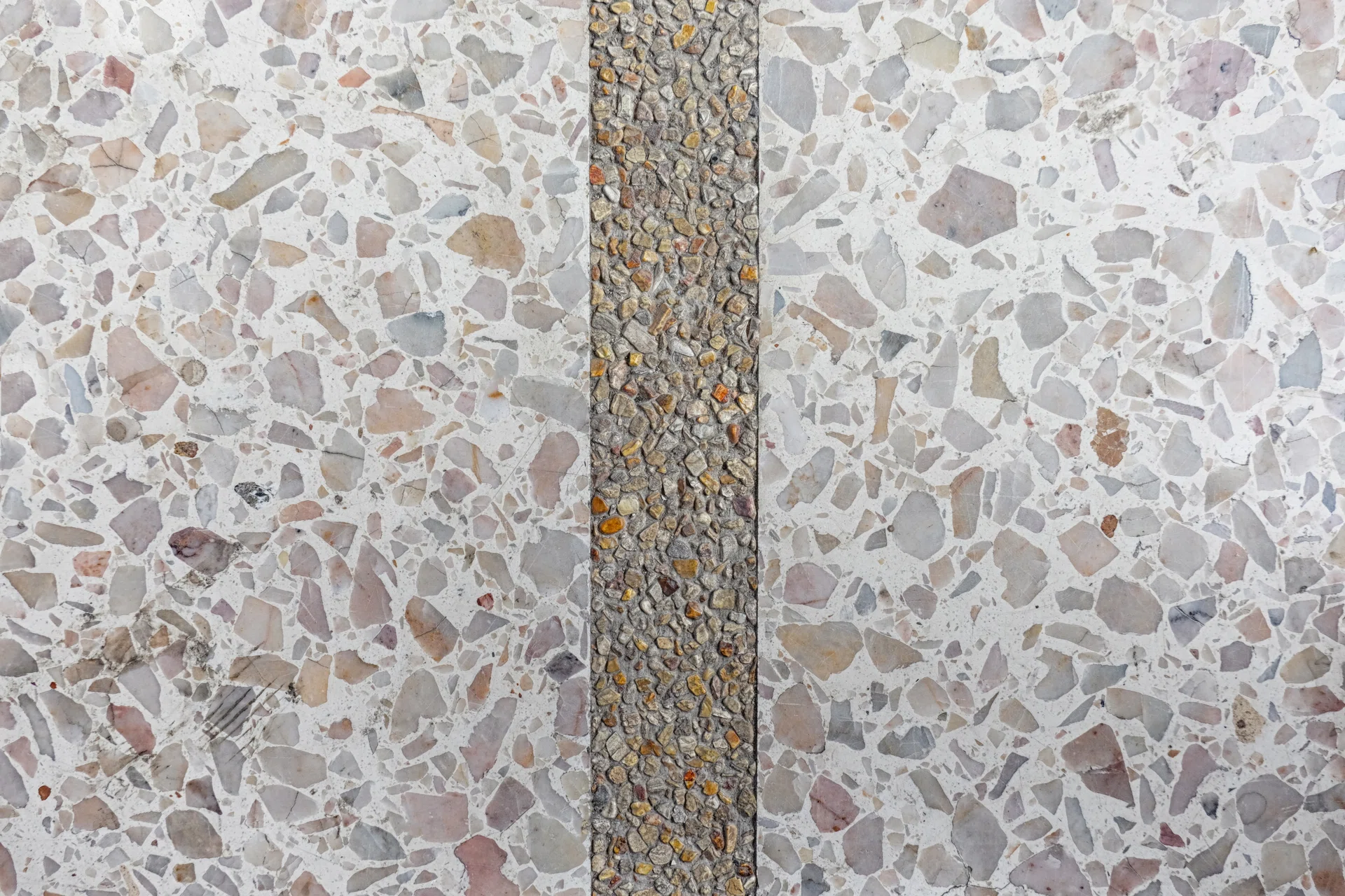 A tranquil pathway adorned with a mosaic of stones.