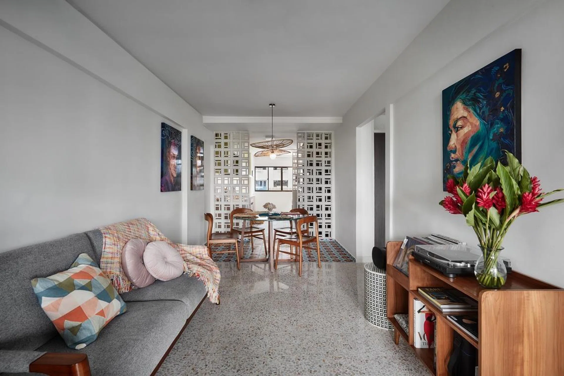 The living and dining areas sit within a long, open plan—a space homeowner Jerusha Tan has made her own..
