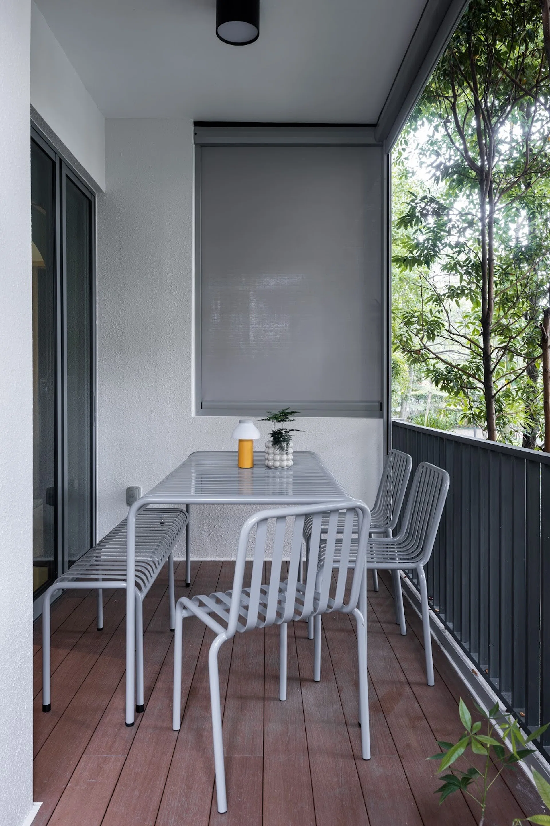 Homeowner Nicholas’ outdoor balcony in central Singapore with a 10-seater dining table.