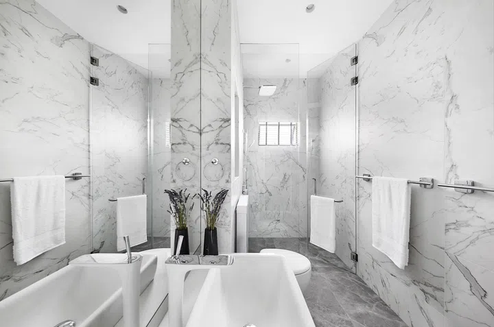 A luxurious master bathroom after renovation in a 3-bedroom condo in East Coast.