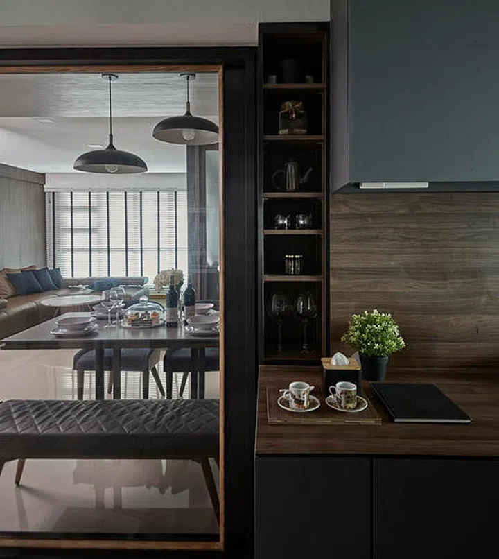 A wall between the kitchen and dining area was hacked to create the illusion of spaciousness, while allowing more natural light into the kitchen. Interior design by Carpenters.