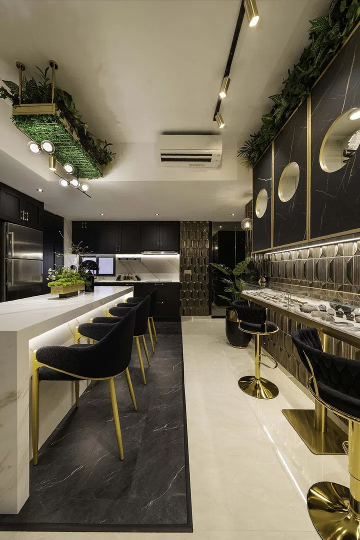 A modern luxury kitchen island dining table in the kitchen of a banking couple's 3-bedroom condominium in West Coast.