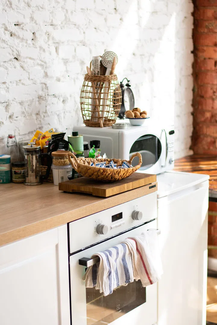Kitchen wooden table top and kitchen blur background interior style Scandinavian. 