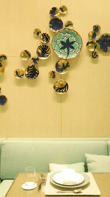 22k Gold porcelain plates that punctuate the walls.
