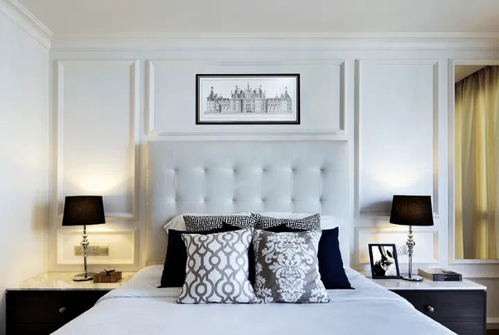 These panels were customised to frame the tall tufted headboard. Design: Mong Design Studio