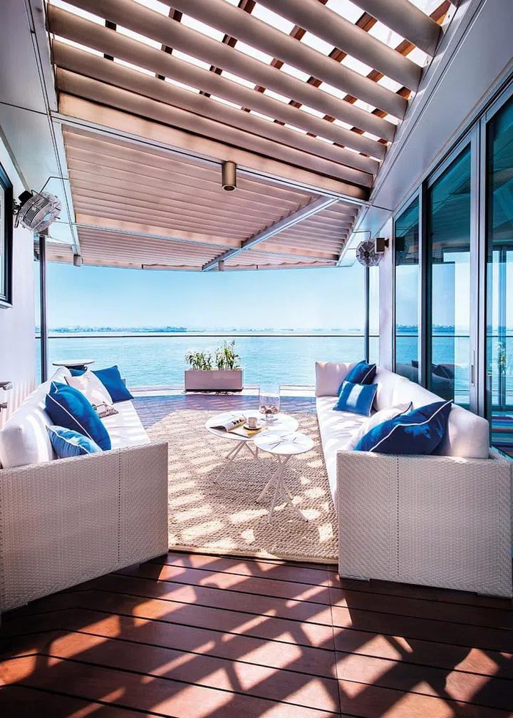 Beach house staples of white, off-white and blue offer a breezy, relaxed vibe.