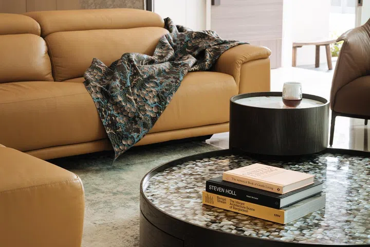 A set of 2 of round, mother-of-pearl coffee tables in the living room of this 6,534 sq ft semi-detached at Jalan Belibas, Upper Thomson designed by Metre Architects.