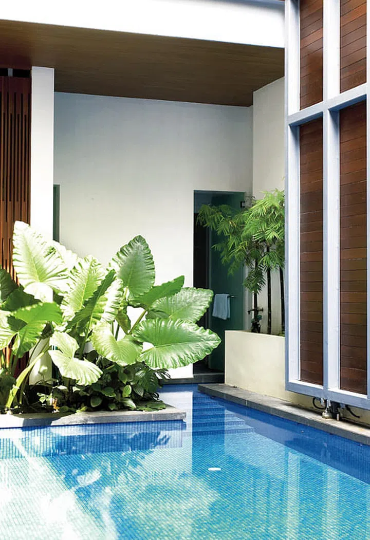 A connecting door allows swimmers to head straight in and out of the pool without having to trek around the rest of the house first.