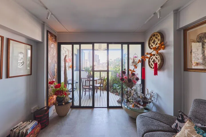 A small balcony retreat was created beside the living room, giving Ivan a dedicated spot to enjoy plants, fresh air, and the morning sun.