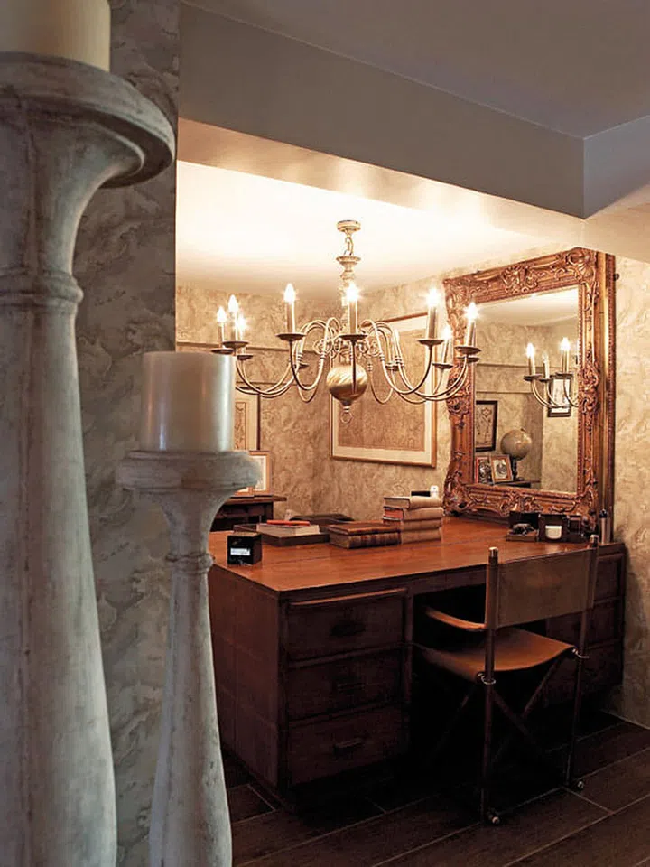 A chandelier usually doesn’t work well with a low ceiling, but in this basement, it creates a dramatic statement.