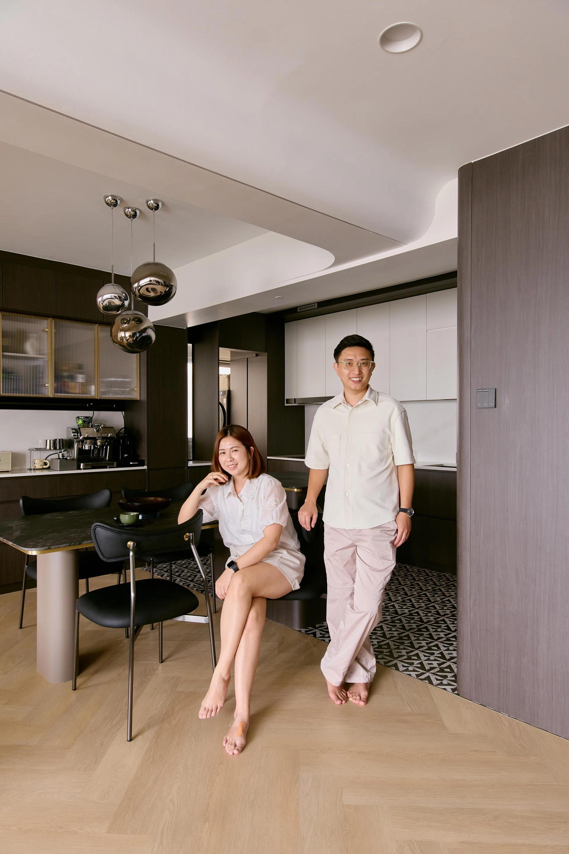 Tay Siew Wee and Wee Shae Ling, both 34 years old, poses for a photo in their 5-room HDB BTO in Woodlands.