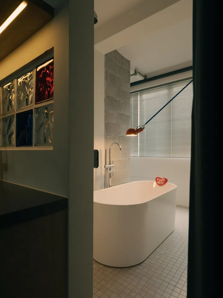 Throughout the home are subtle industrial-cool elements contrasted with pops of colour.