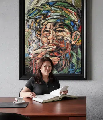 Calsia, founder and director of Mu-Dian, a homegrown carpentry company, poses in her own home, a 1,650 sq ft 3-bedroom Marine Parade condo.