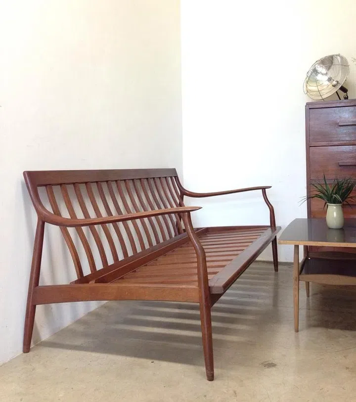 A mid-century teak wood sofa frame at the Long Longtime Store second hand furniture shop