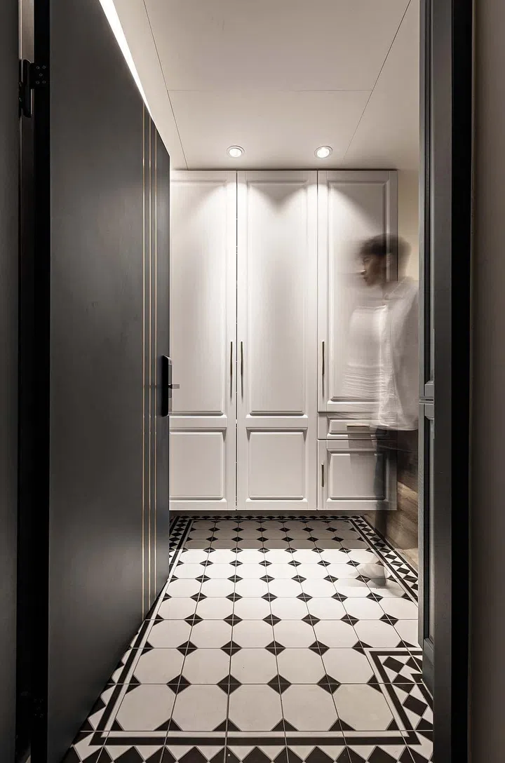 The floating shelves make this transitional foyer space more spacious.